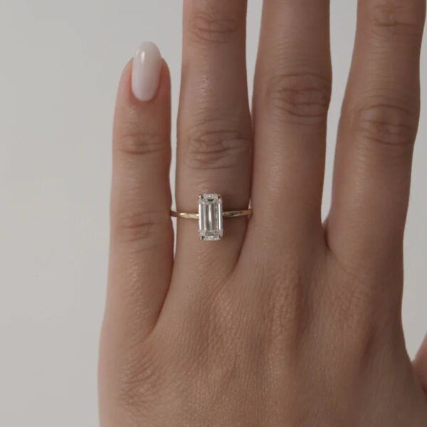 Elegant Emerald-Cut 5A White Cubic Zirconia Gold-Plated 925 Silver Ring on a finger
