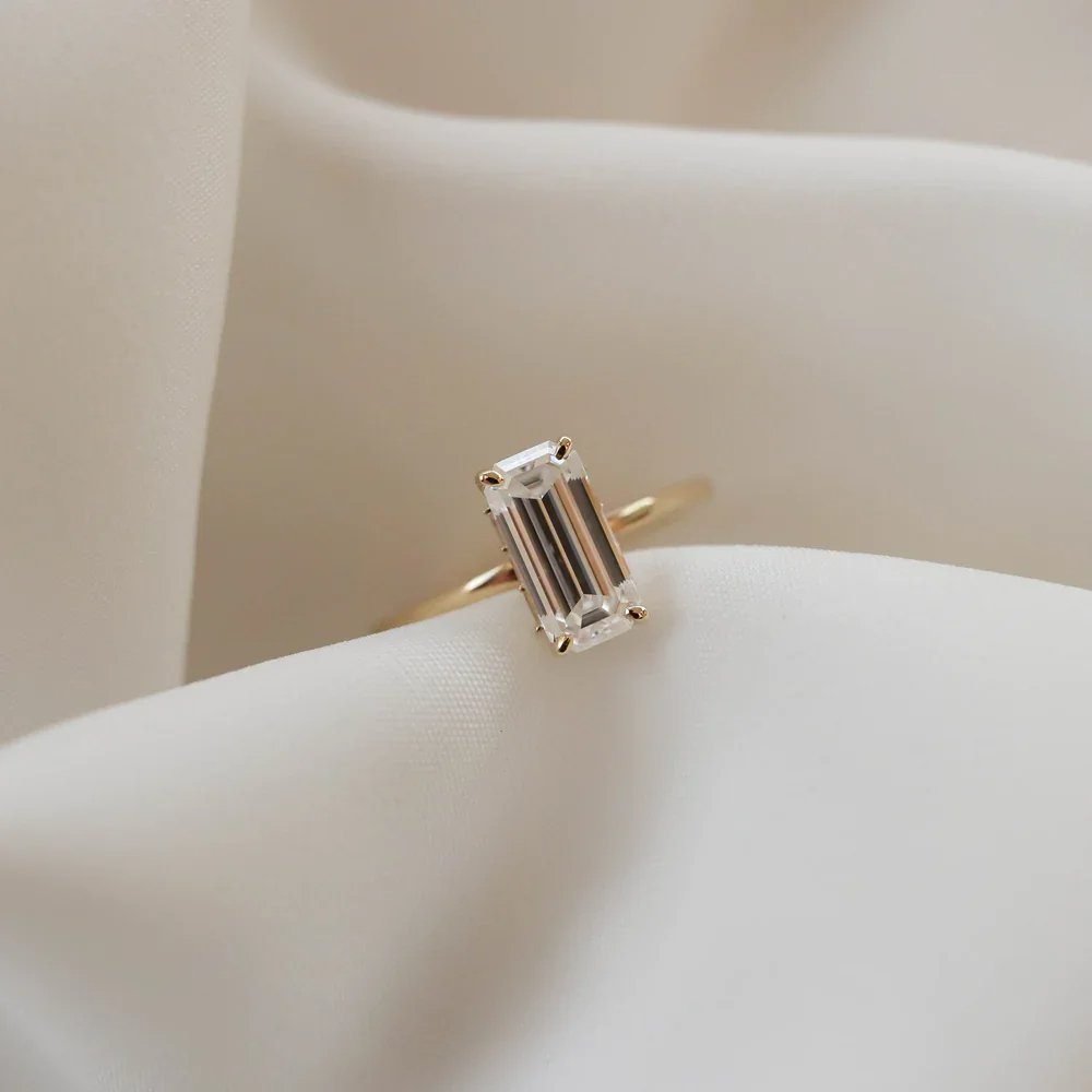 Elegant Emerald-Cut 5A White Cubic Zirconia Gold-Plated 925 Silver Ring beige background